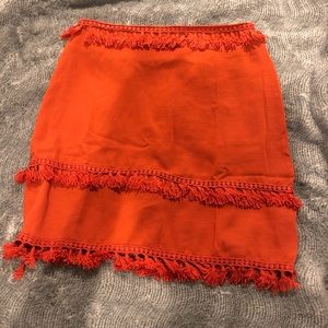 orange tassel skirt